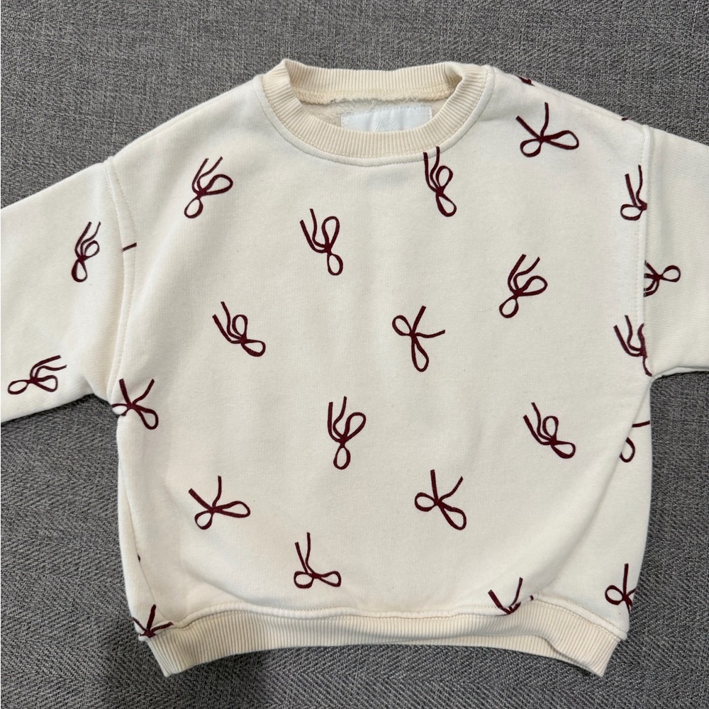 Zara Cream Sweater with Red Bow Pattern